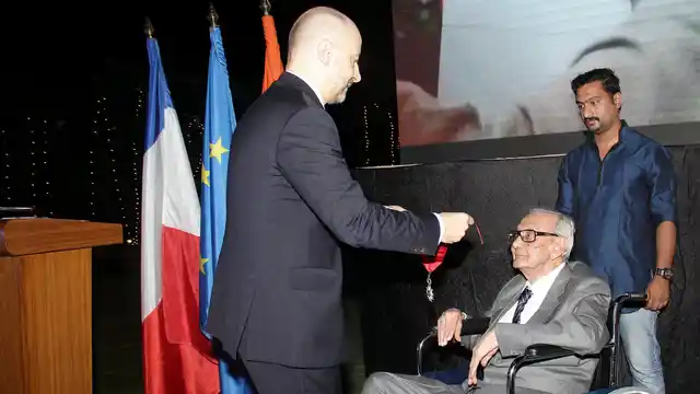 Raza being pinned the medal by French Ambassador Francios Richer, on behalf of the French President. (Photo courtesy: Sahar Zaman)