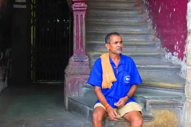 A delivery man outside Parsi Dairy Farm taking a break