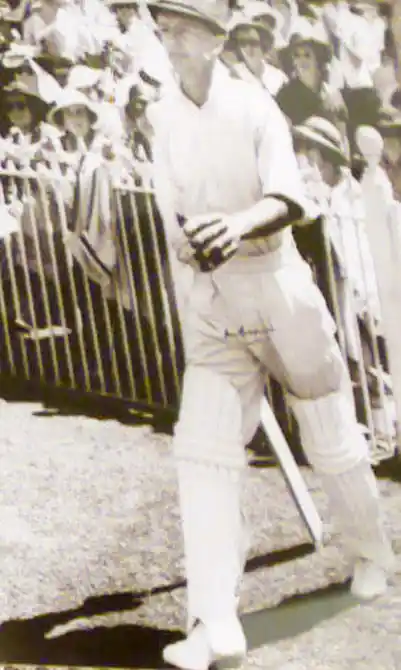 Sir Don Bradman walks out to bat.