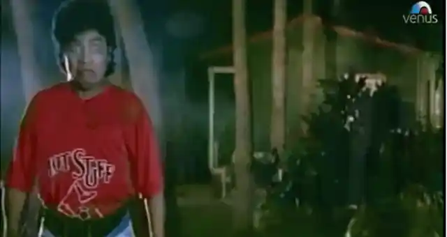 This is the scariest Johnny Lever can ever look, the Tamilian caretaker in <i>Khiladi</i> (1992) (Source: <a href="https://www.youtube.com/watch?v=kpA-imD7dhU">YouTube/Venus Movies</a>)