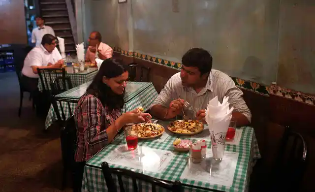 Customers having lunch at the popular Irani cafe Britannia and Co in Mumbai (Photo: Reuters)