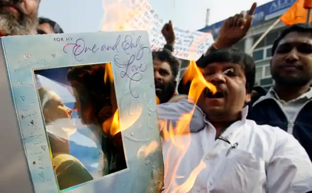 Shiv Sena activists shout slogans and burn Valentine’s Day cards during a protest in New Delhi on February 14, 2007. Hardline Hindu activists protested against celebrations of St Valentine’s Day in the Indian capital on Wednesday, calling them immoral and a corruption of the country’s ancient civilisation. (Photo: Reuters)