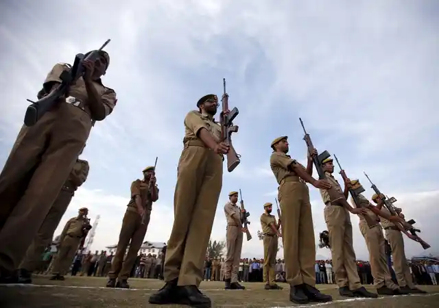 Policemen at wreath-laying ceremony for police officer Altaf Ahmad at the police control room in Srinagar. (Photo: Reuters)