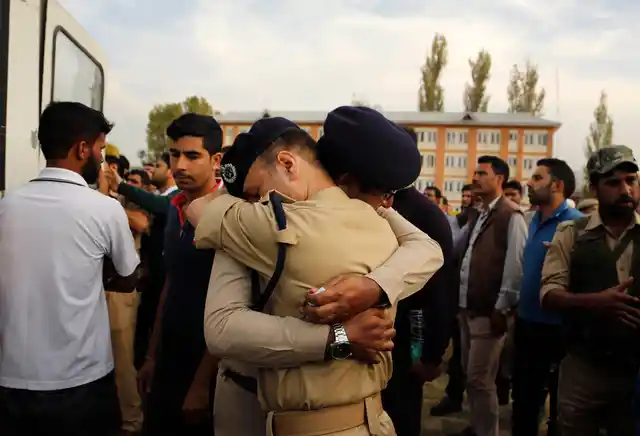Police officers mourn Altaf Ahmad during the wreath laying ceremony. (Photo: AP)