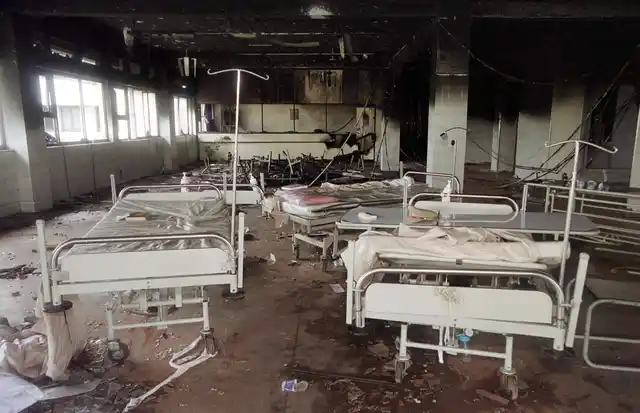 Hospital beds lie scattered among the debris in a hospital sacked by an angry mob in Thane, 35 km away from Mumbai on August 26, 2001. The violence was sparked by the death of Anand Dighe, 50, a leader of Shiv Sena, who died of a cardiac arrest in the hospital after being involved in a road accident. (Photo: Reuters)