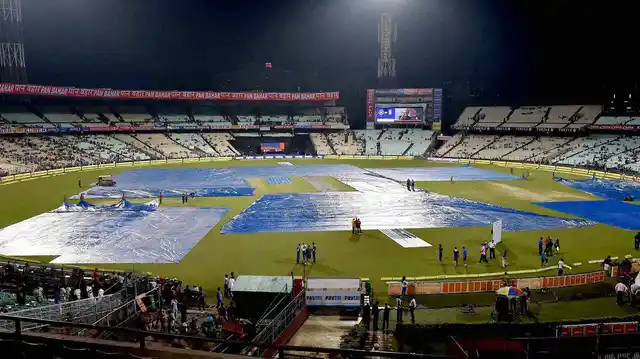 Covers in place at the Eden Gardens as it rains before the start of the 3rd T20. (Photo: PTI)