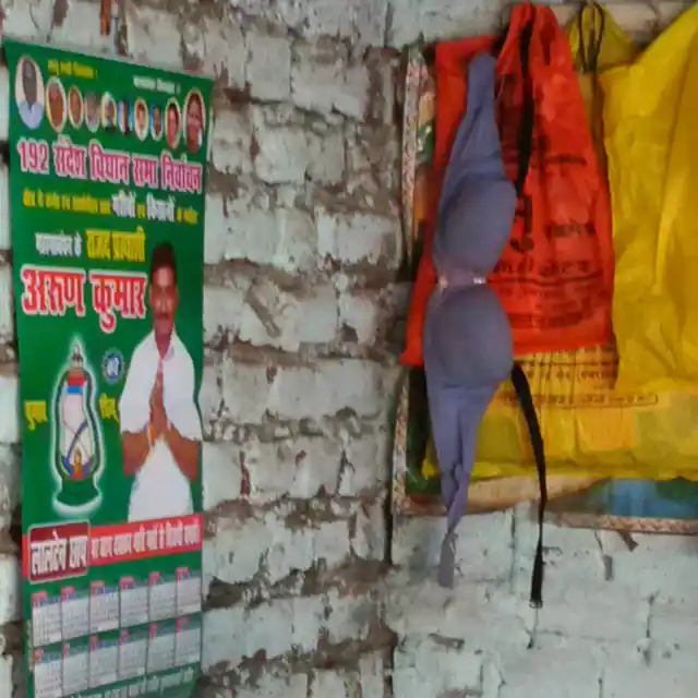 Setting the stage: Campaign posters and dusty bras hang from nails in crumbling walls. (Photo: Chandan Nandy)