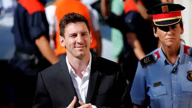 In this Sept. 27, 2013 file photo, FC Barcelona star Lionel Messi, left, arrives at a court to answer questions in a tax fraud case in Gava, near Barcelona, Spain. (Photo: AP) 