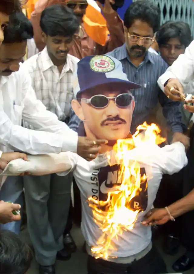 Members of Shiv Sena had set fire to an effigy of former Indian cricket captain Mohammad Azharuddin in Mumbai on November 3, 2000, after he was accused by the Central Bureau of Investigation of fixing cricket matches. (Photo: Reuters)