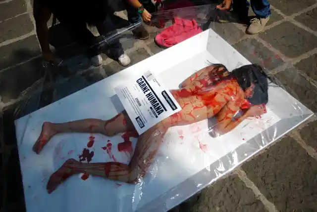 Animal rights activists protest against meat consumption through a performance to promote vegetarianism in Mexico City, 2012. Members of AnimaNaturalis staged the performance to mark the World Vegan Day celebrated on November 1. (Photo: Reuters)