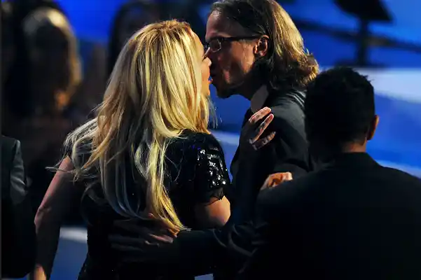 Britney Spears kisses Jason Trawick at the VMAs held in 2011
