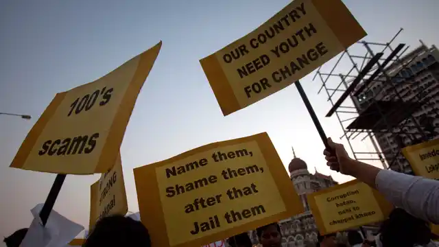 Protesters holding placards attend an anti-corruption rally in support of the “Lokpal Bill” near the Gateway of India, Mumbai, May 1, 2011. (Photo: Reuters)
