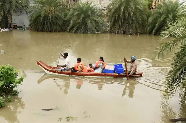 Photo of fishermen helping people commute on December 3, 2015. (Photo: PTI)