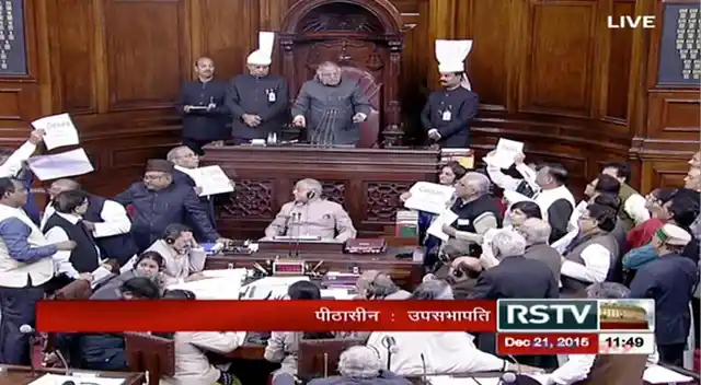 Congress members displaying placards in the Rajya Sabha. (Photo: Screengrab)