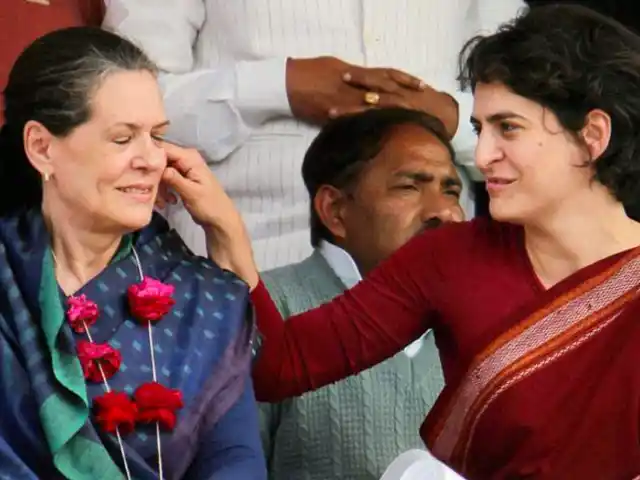 Priyanka Gandhi pulls Sonia Gandhi’s cheeks during a public rally. (Photo Courtesy: Twitter/<a href="https://twitter.com/search?f=images&vertical=default&q=Priyanka%20Gandhi%20Sonia%20Gandhi&src=typd">@Butchikotaiah</a>)