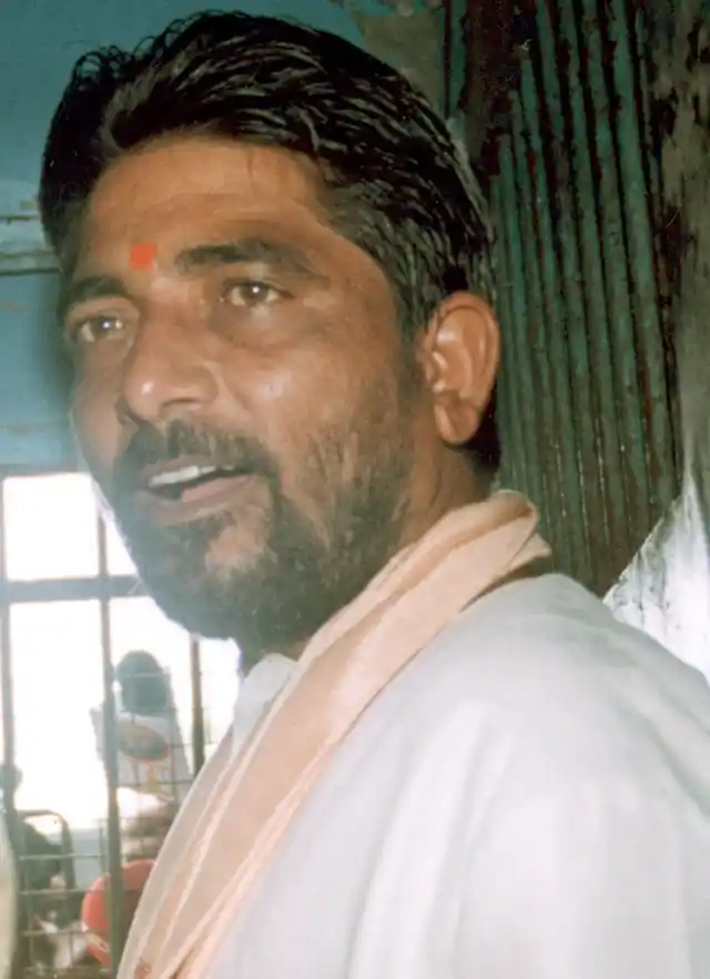 Hindu activist and ringleader Dara Singh is seated in a police van in Bhubaneswar. 