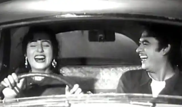 Madhubala and Kishore Kumar in a comic scene from <i>Chalti Ka Naam Gaadi</i>