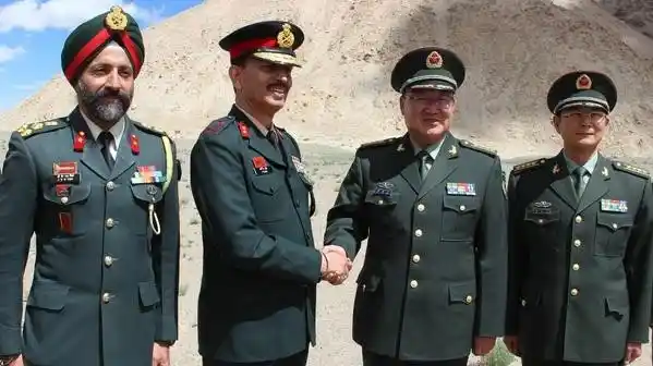 Chinese military delegation greets Indian army officials on Independence Day during a special Border Personnel Meeting at Chushul in Eastern Ladakh on 15 August 2015. (Photo: IANS)