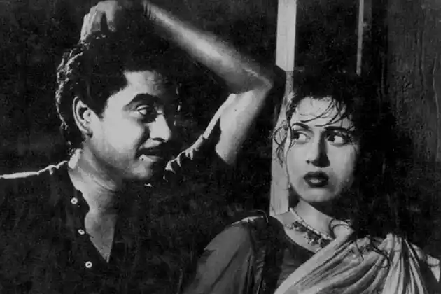 Ek ladki bheegi bhaagi si: Madhubala and Kishore Kumar, in a scene from <i>Chalti Ka Naam Gaadi</i>