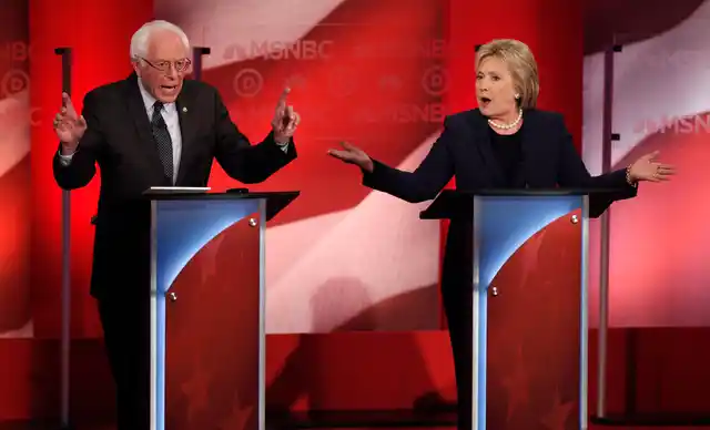 Democratic U.S. presidential candidate and Senator Bernie Sanders (L) and former Secretary of State Hillary Clinton speak simultaneously as they discuss issues during the Democratic presidential candidates debate at the University of New Hampshire in Durham, New Hampshire (Photo: Reuters)