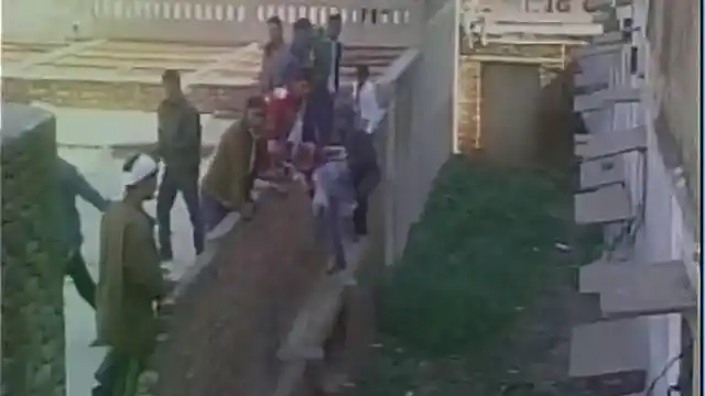 People are seen scaling wall to help examinees cheat. (Photo: ANI)