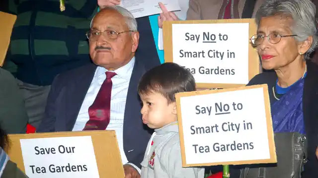 File photo of citizens of Dehradun protesting the Uttarakhand government’s plan to build a Smart City on Dehradun’s tea gardens. (Photo: IANS) 