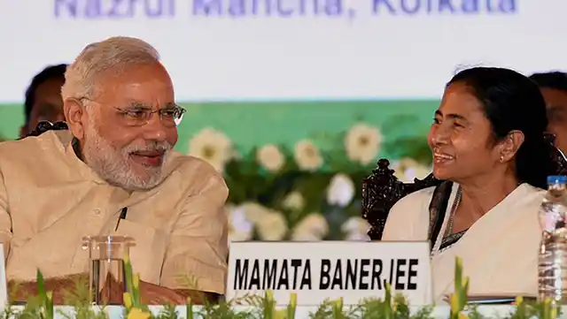 In this file photo, Prime Minister Narendra Modi is chatting with West Bengal Chief Minister
Mamata Banerjee. (Photo: PTI)