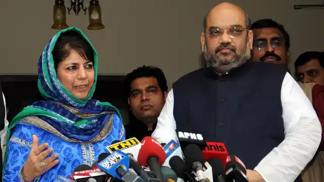 Photo of Mehbooba Mufti and BJP President Amit Shah addressing media. (Photo: PTI)