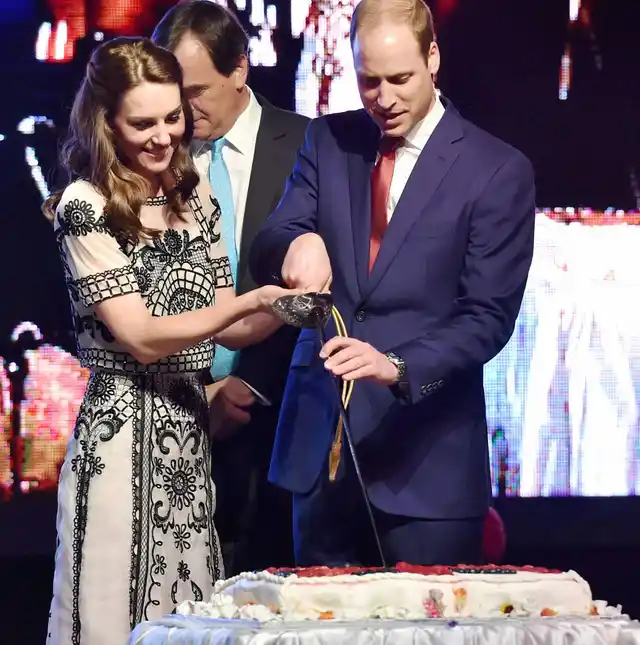 Prince William and Catherine, Duchess of Cambridge cutting a cake during 90th birthday celebration of The Queen Elizabeth II at the residence of British High Commissioner in New Delhi (Photo: PTI)
