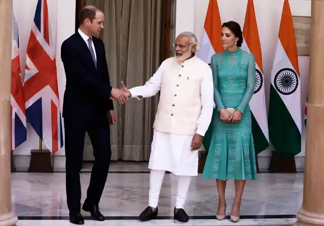 Kate Middleton wore a pastel green dress interspersed with patches of fine lace (Photo: AP)