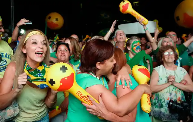 Anti-government demonstrators celebrate after the lower house of Congress voted to impeach Brazil’s President Dilma Rousseff in Sao Paulo, Brazil, Sunday, April 17, 2016. (Photo: AP) 