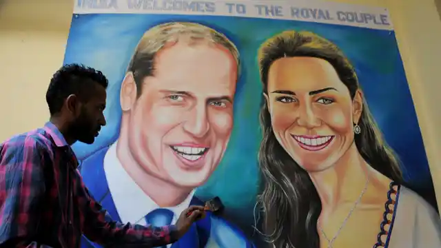Artist Jagjot Singh Rubal giving final touches to the painting of Prince William and Kate Middleton ahead of their tour of India in Amritsar, on April 9, 2016. (Photo: IANS)