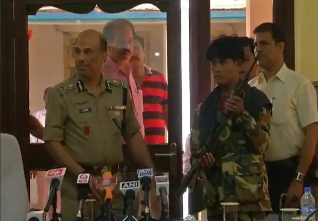 NLFT member facing the media along with the police in Agartala (Photo: ANI)