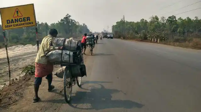Villagers from Khinda line up at 4 am at the mines and carry over 120 kilos of coal on their bicycles daily, to be sold to hotels and brick makers. (Photo Courtesy: Ankush Vengurlekar)