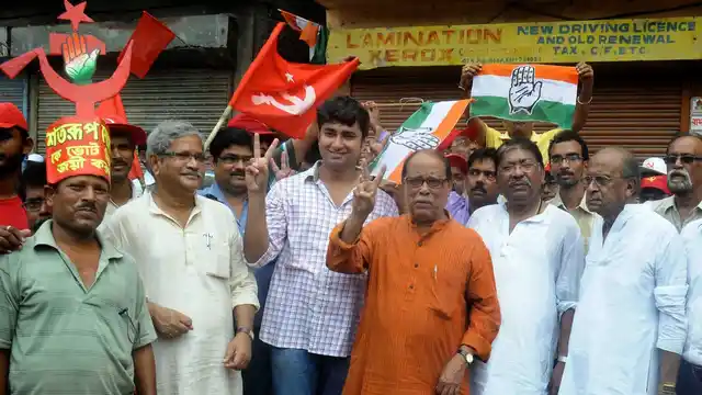 CPI-M leaders Satarup Ghosh and Ashok Bhattacharya participate in a Left-Congress alliance rally in Kolkata, on April 28, 2016. (Photo: Kuntal Chakrabarty/ IANS)