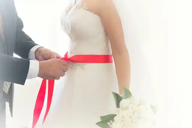 The red ribbon signifies the bride’s virginity in traditional Turkish weddings. (Photo: iStockphoto)