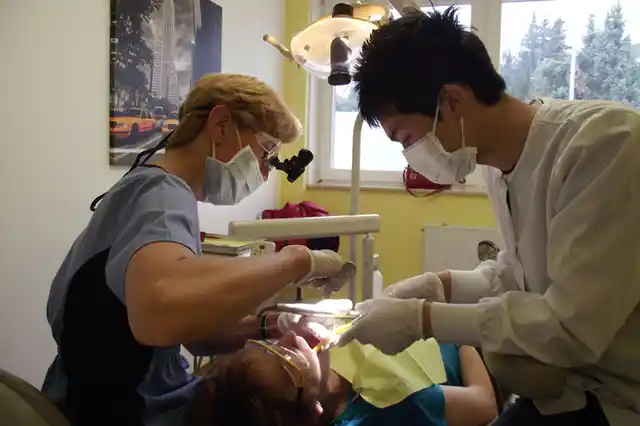 At a dental clinic at the Ramstein Air Base in south-western Germany, Headquarters of US Air Forces in Europe, a dentist examines her patient. In Central and Eastern Europe, women comprise 40 per cent of researchers in science, including medical and health sciences — 10 percentage points higher than the world average. (Photo Courtesy: Ryan Langhorst)