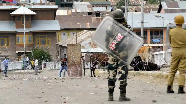 Protesters clash with security personnel in Baramulla of Jammu and Kashmir on July 11, 2016. (Photo: IANS)