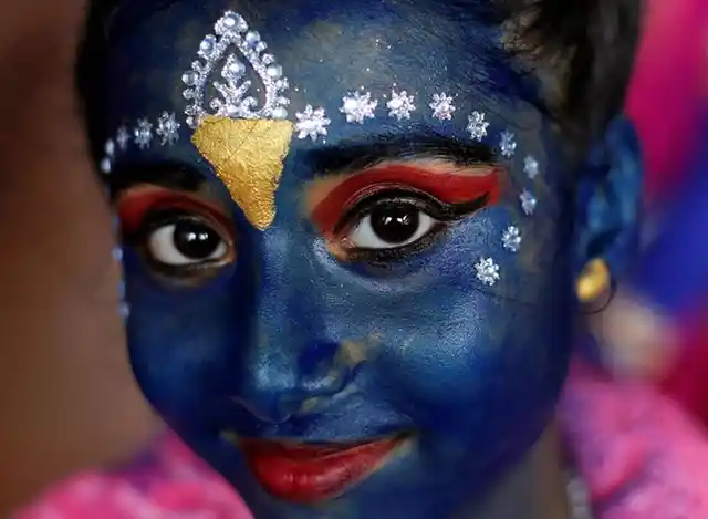 A student participates in celebrations ahead of the Janmashtami festival (Photo: Reuters)