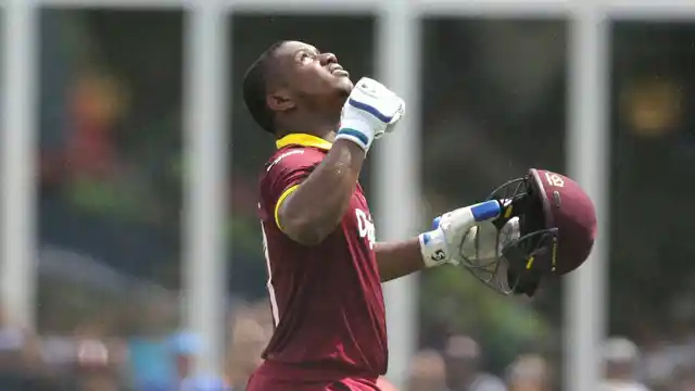 West Indies’ Evin Lewis reacts after scoring a century during the first Twenty20 international cricket match against India. (Photo: AP)