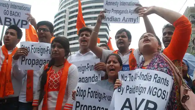 ABVP activists stage a demonstration against Amnesty International India in New Delhi on 17 August 2016. (Photo: IANS)
