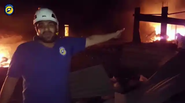 In this grab taken from video provided by the Syrian Civil Defence White Helmets, a member of the team describes the damage after an airstrike, in Aleppo, Syria, Monday, 19 September 2016. (Photo: AP)