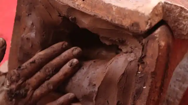 Filling the visible void with red soil and organic fertiliser mixture. (Photo: The Quint)