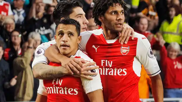 Alexis Sanchez celebrates a goal with his teammates. (Photo: AP)