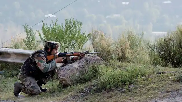 An army soldier takes position near an army camp during the terror attack in Uri, Jammu and Kashmir on 18 November 2016. (Photo: PTI)