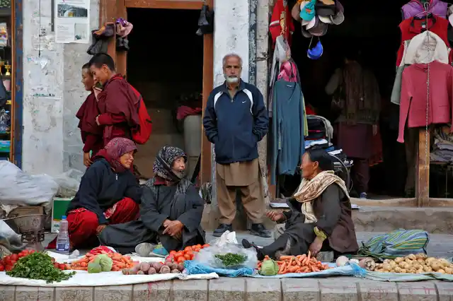 Vegetable vendors chat in Leh, the largest town in the region of Ladakh, nestled high in the Indian Himalayas. (Photo: Cathal McNaughton)