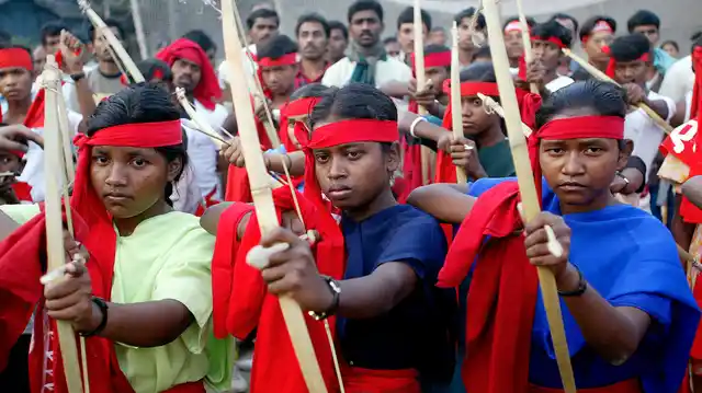 File picture of Naxalites posing with bows and arrows during a rally. (Photo: Reuters)