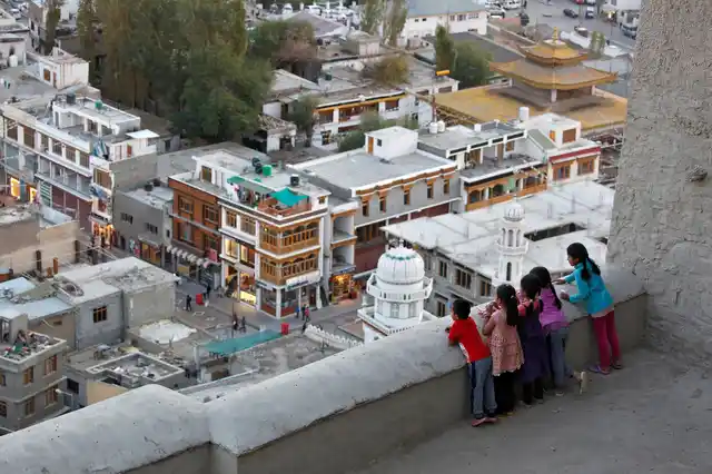 Children look down from the Royal Palace in Leh, the largest town in the region of Ladakh, nestled high in the Indian Himalayas. (Photo: Cathal McNaughton)