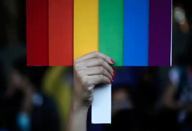 Representative Image: A participant holds a rainbow coloured placard during Delhi Queer Pride Parade, an event promoting gay, lesbian, bisexual and transgender rights, in New Delhi, 30 November 2014. (Photo: Reuters/Adnan Abidi)
