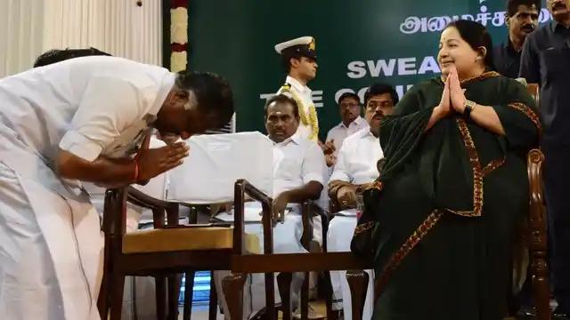 O Panneerselvam bows down before his leader, AIADMK supremo J Jayalalithaa, during her swearing-in ceremony as Tamil Nadu chief minister in Chennai, 23 May, 2016. (File Photo: IANS)
